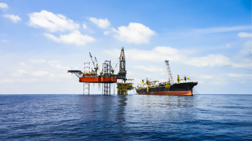 Offshore oil and gas industry facility with drilling rig, oil platform and FPSO shutterstock_1028964364